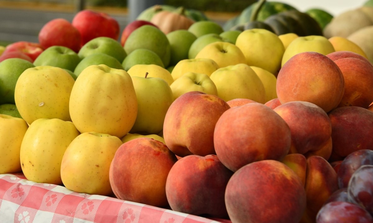 A farmers market stall selling fruit