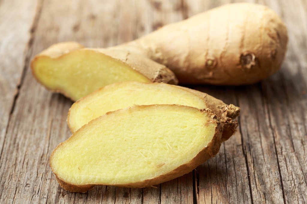 Sliced ginger on a wooden table