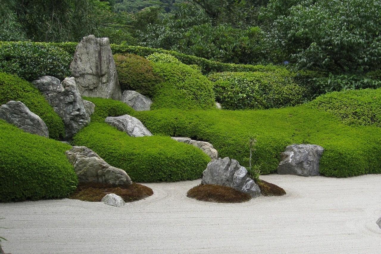 A zen garden with large rocks in it