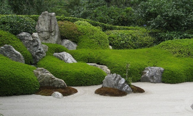 A zen garden with large rocks in it
