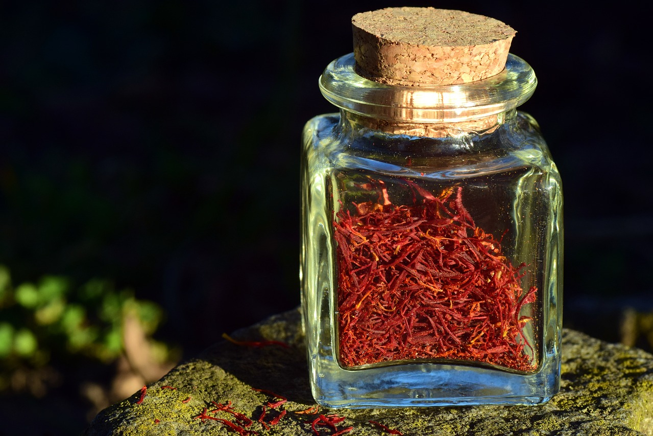 A glass jar of dry saffron threads